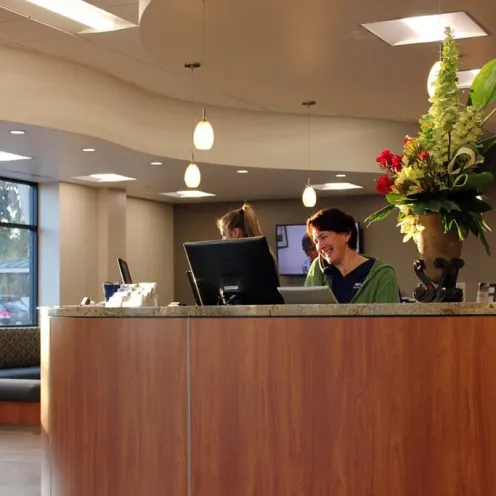 A view of our front desk with staff taking calls